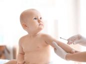 Doctor vaccinating baby in clinic
