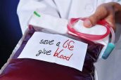 doctor with a blood bag with the text safe a life give blood