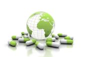 Medicine pills and world globe isolated on white
