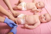 Babies receiving vaccine. Pediatrician giving a baby girl intram