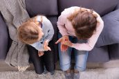 Girl Learning Sign Languages From Woman