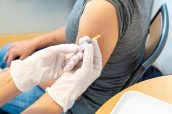 A horizontal view of female doctor vaccinating a female patient