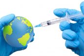 Doctor hold a earth globe in hands and a medical syringe with vaccine against corona virus. 3D rendering. Elements of this image furnished by NASA.