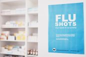 Healthcare, pharmacy or flu shots poster to promote vaccines or medicine at a drugstore. Advertising banner, pharmaceuticals background or shelf with medical pills, supplements or retail medication.