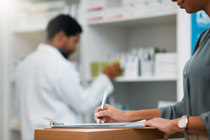 Woman at pharmacy, clipboard and medical insurance information at counter for script for prescription medicine. Paperwork, writing and patient at pharmacist with application for pharmaceutical drugs