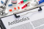 The word Antibiotics written on a clipboard